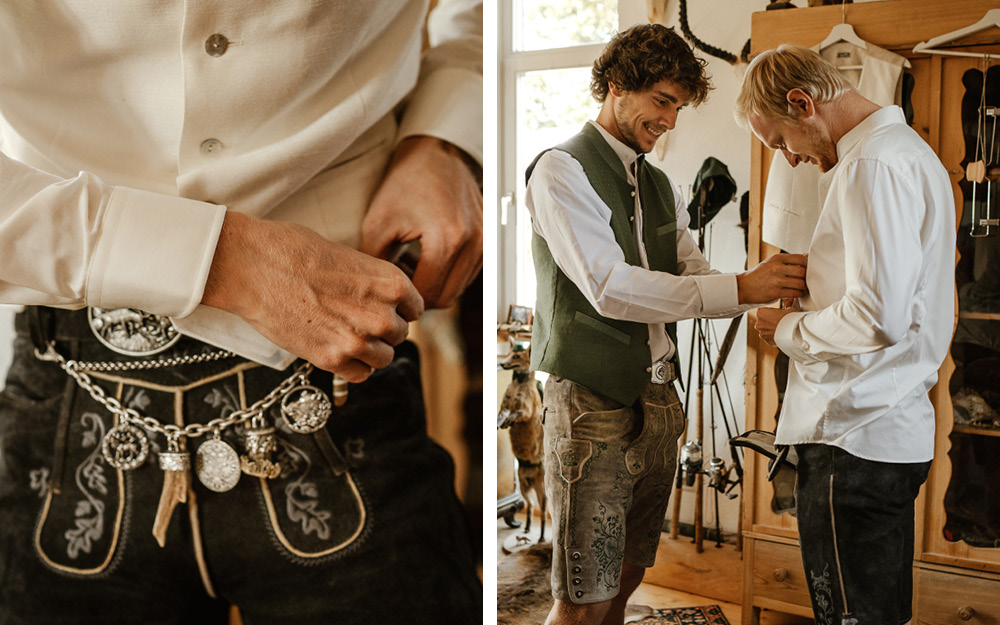 Der Bräutigam wird ebenfalls im traditionell bayrischen Look gestyled und erhält eine Lederhose. Silberner Schmuck ziert diese und lässt sie damit festlicher wirken. Der Trauzeuge unterstützt beim Anziehen. 