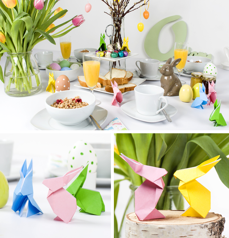 gedeckter Ostertisch dekoriert mit selbstgebastelten Origami Osterhäschen aus Papier in bunten frühlingshaften Farben.